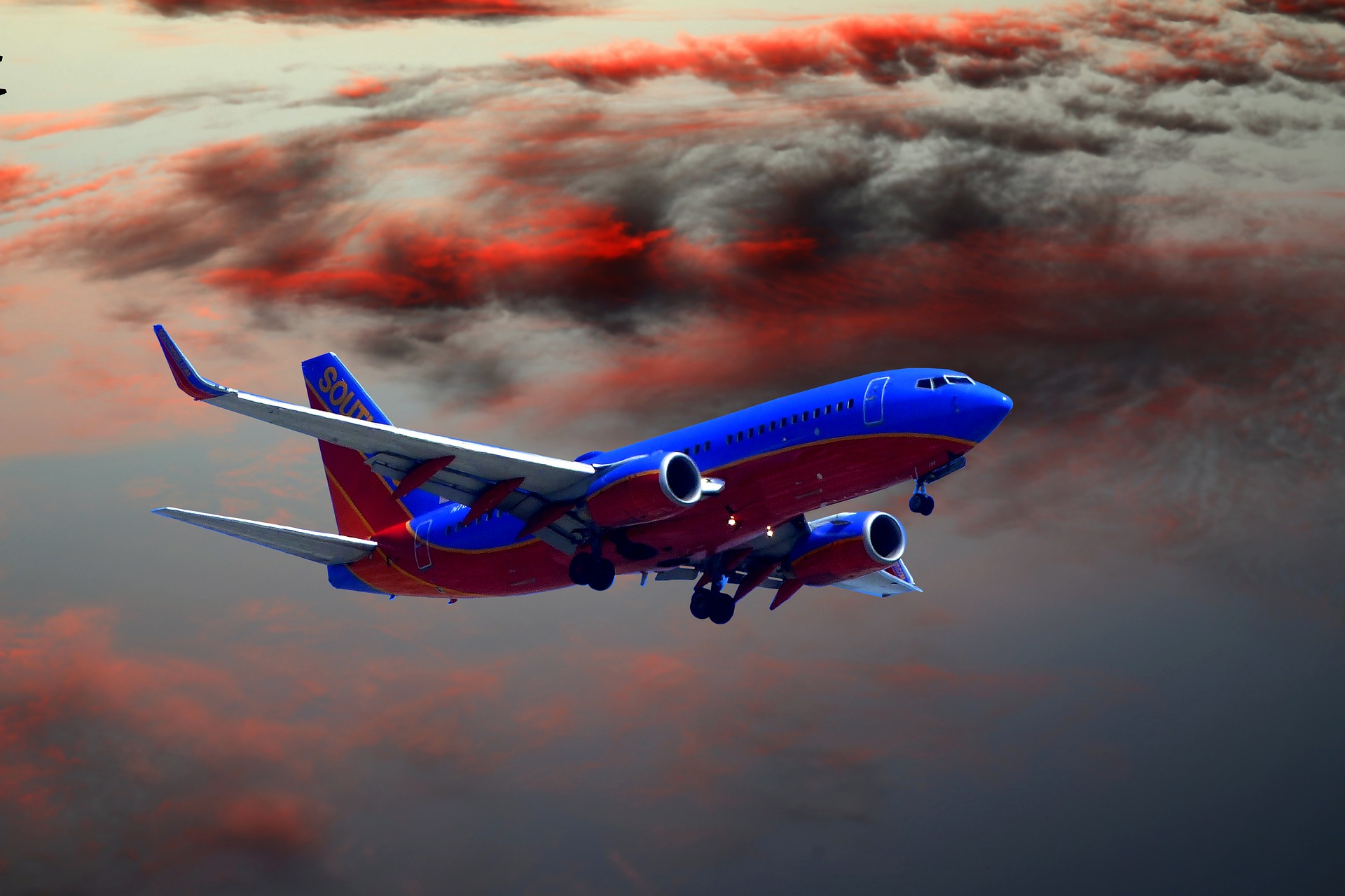Air Jake cargo aircraft in flight at sunset